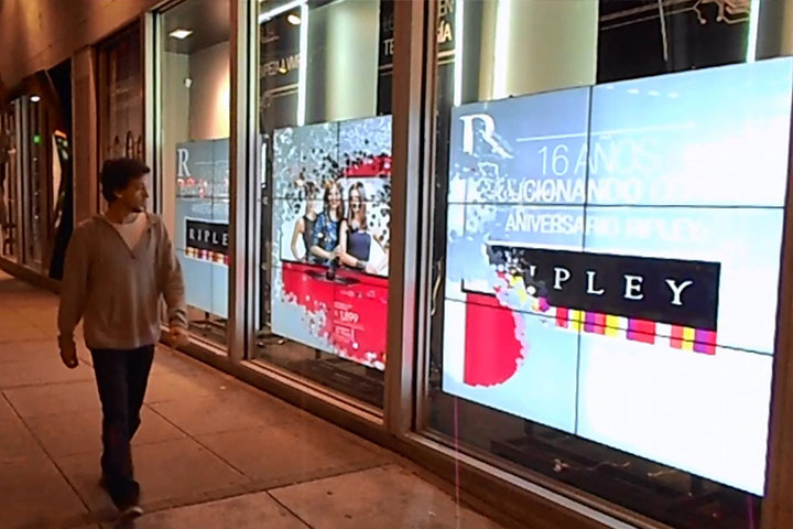 LUMOplay man walking in front of display